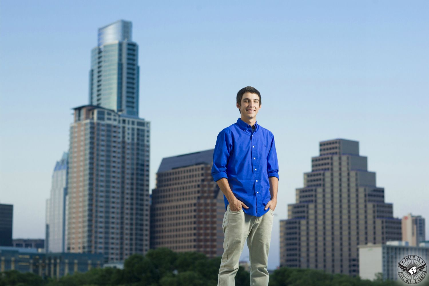 Best senior portrait photographer Austin at the Long Center with Austin skyline in the back.